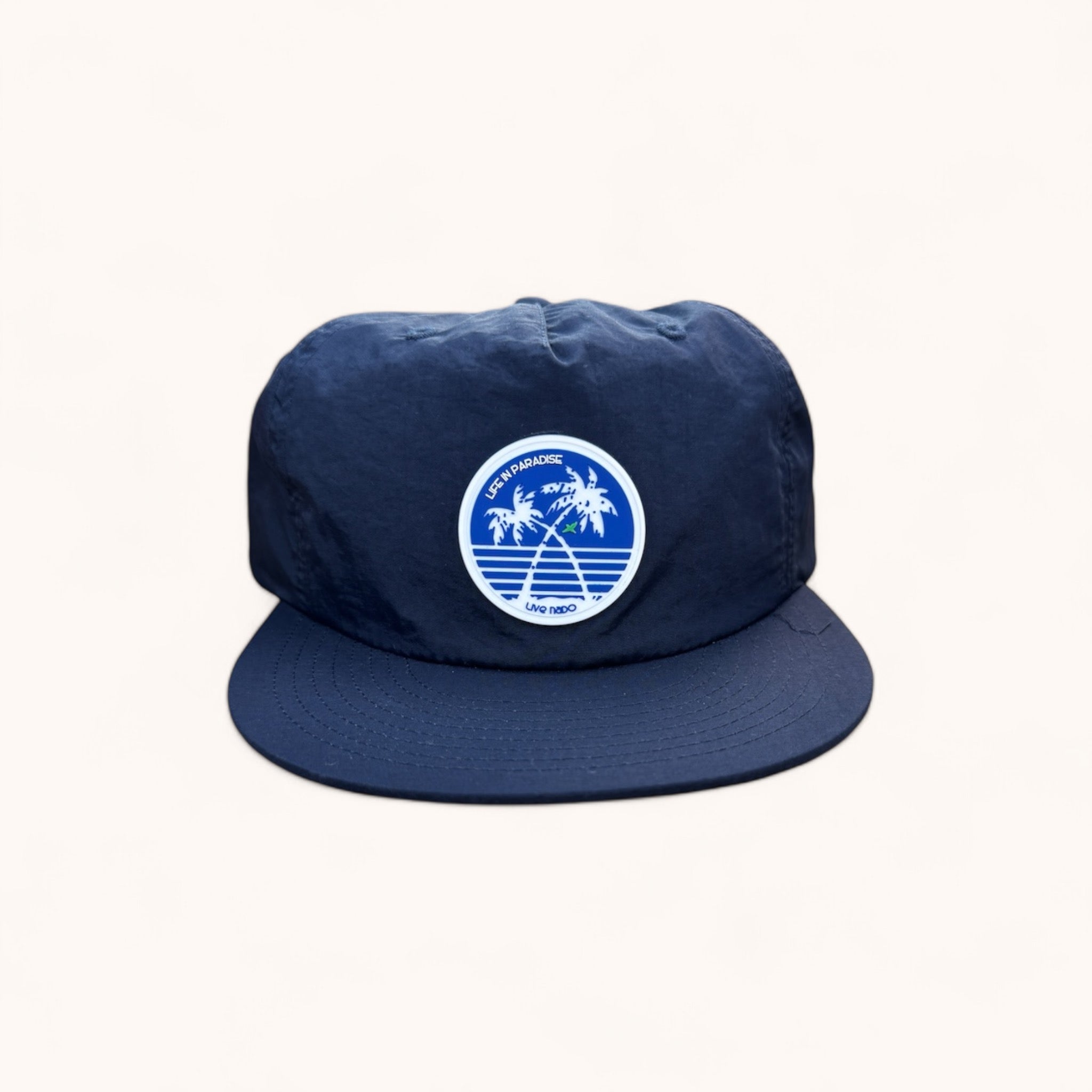 navy flat brim surf cap with Coronado palm trees and green parrot silicone patch that