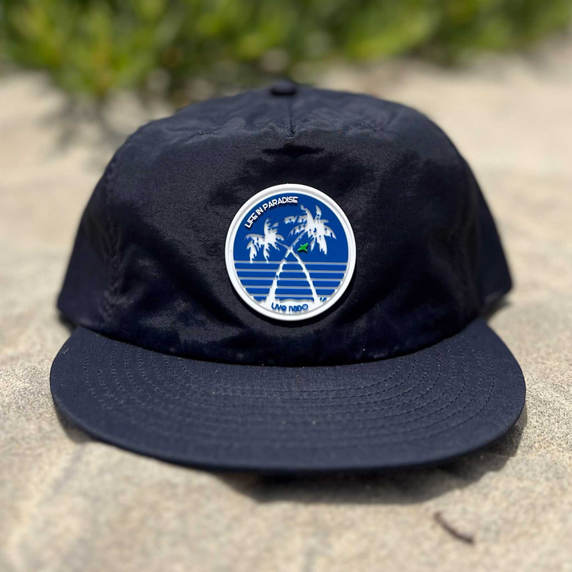 navy, flat brim surf cap with silicone patch of palm trees
