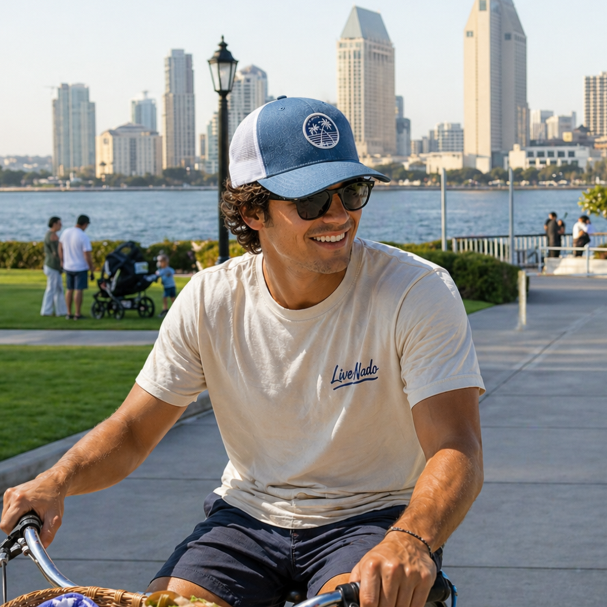 Man riding a bike with a city skyline in the background