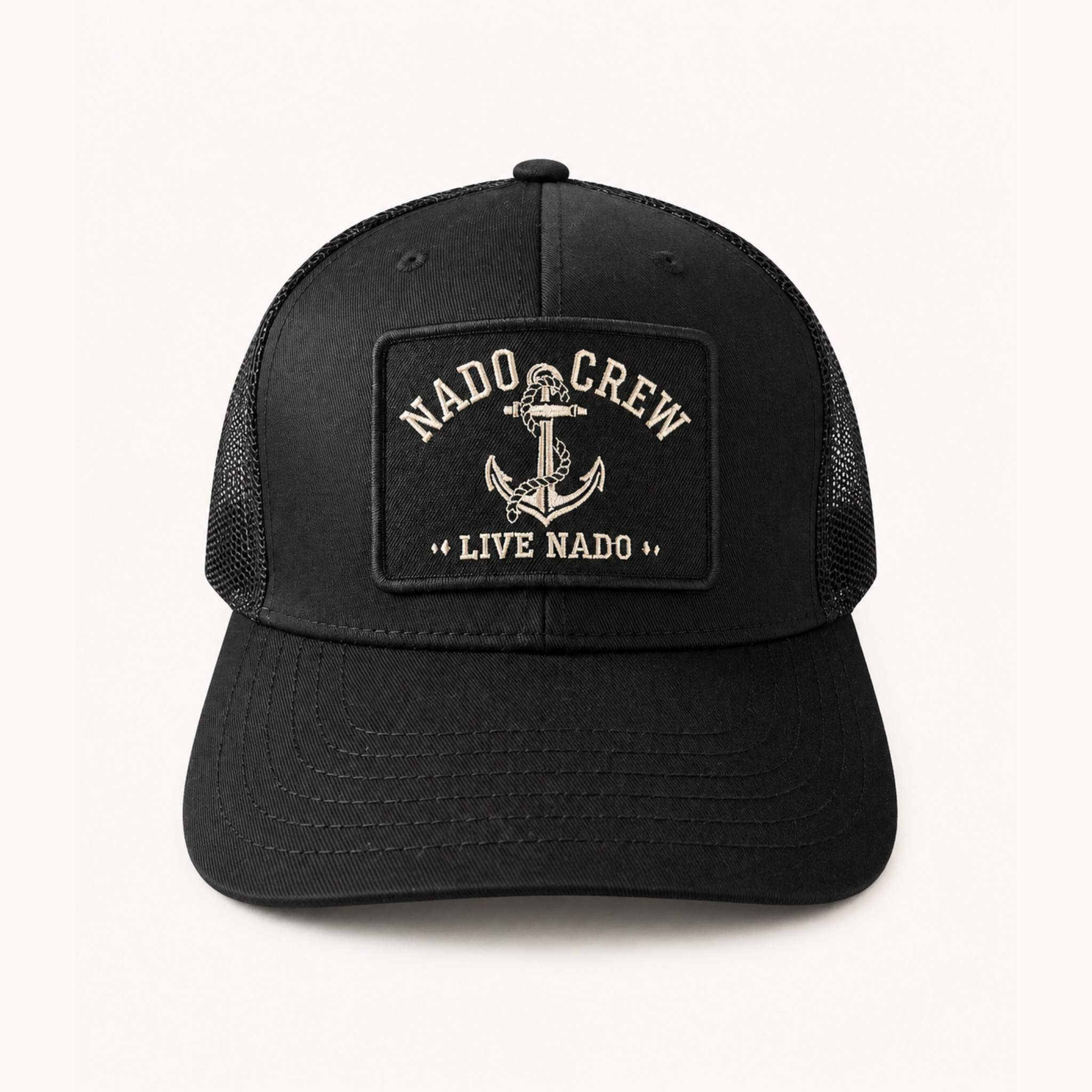 Black cap with 'Nado Crew' and anchor design on a white background