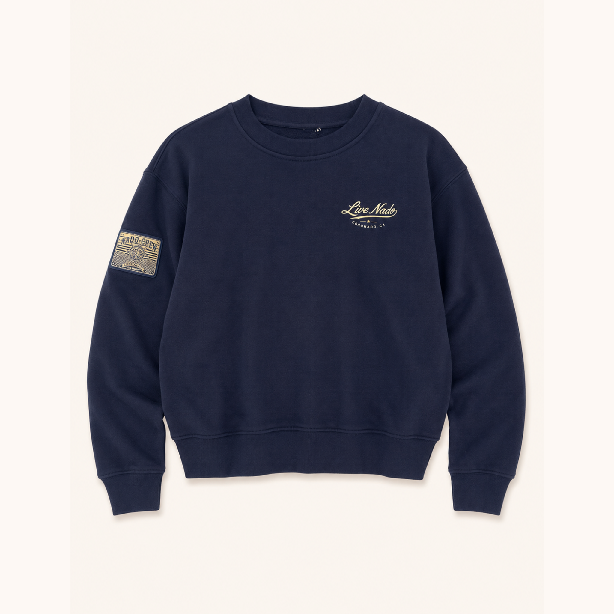 Flat lay showing the front of a navy blue sweatshirt with a small script graphic reading "Live Nado" on the left chest and a patch on the right sleeve.