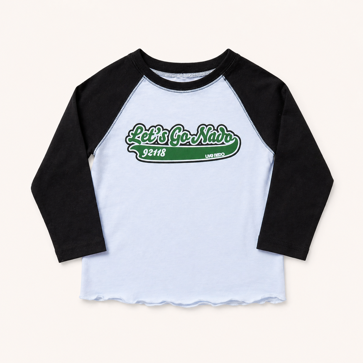 Black and white baseball shirt with green text on a light gray background