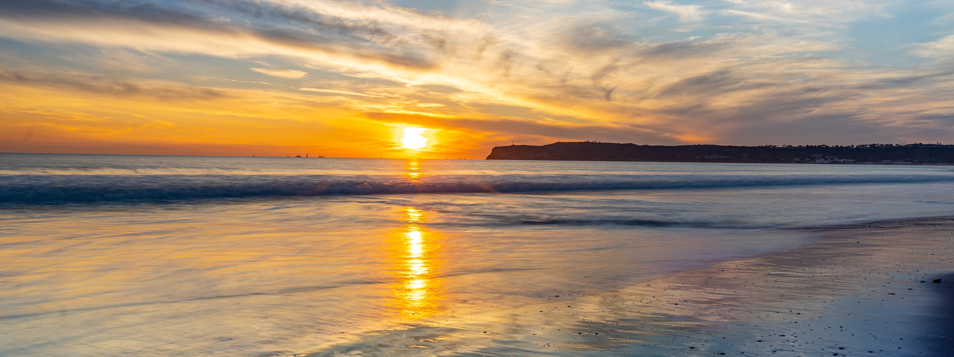 CORONADO SUNSET WITH POINT LOMA BLUFF IN BACKGROUND