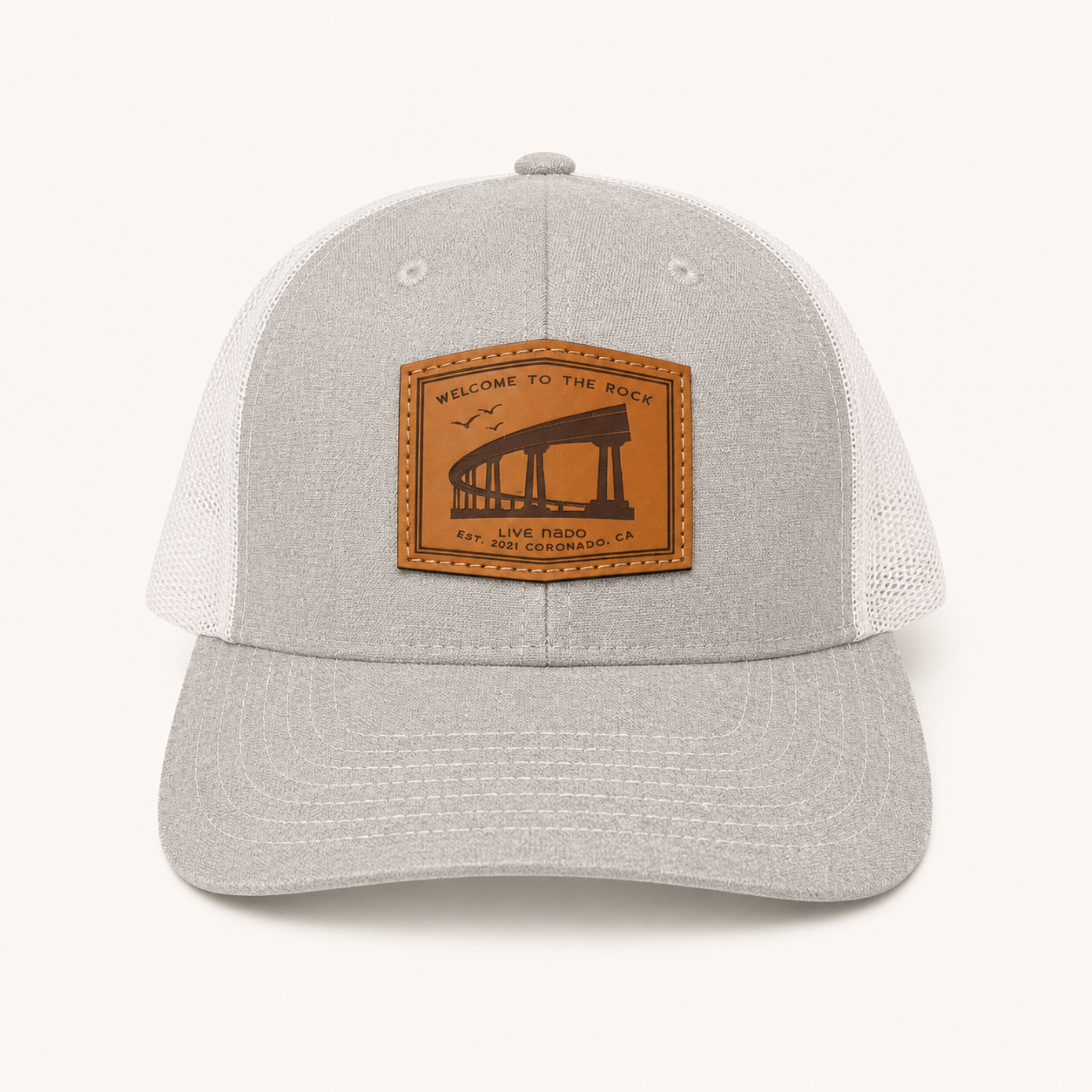 Gray cap with a brown leather patch on a white background