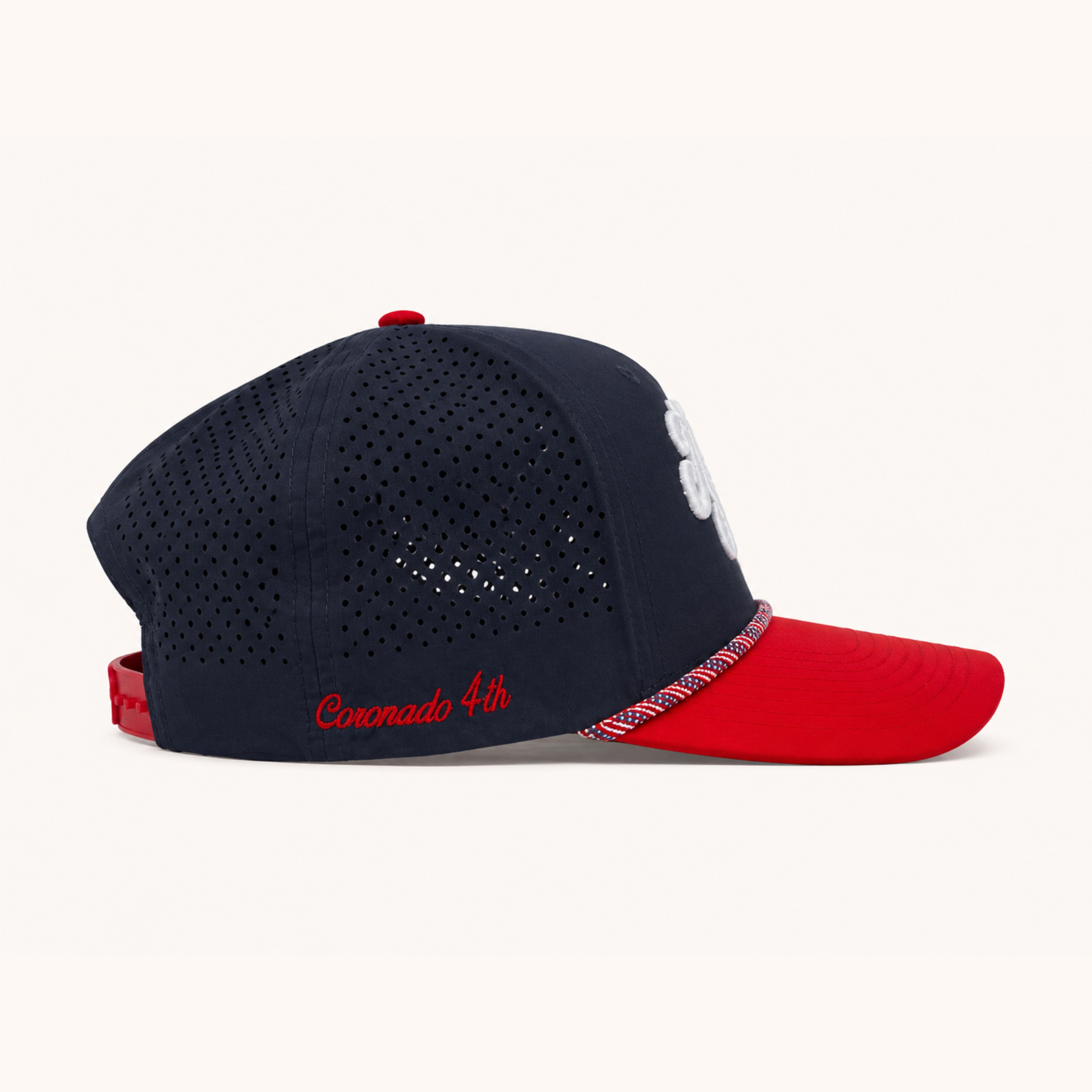 Navy and red baseball cap with 'Coronado 4th' text on a white background