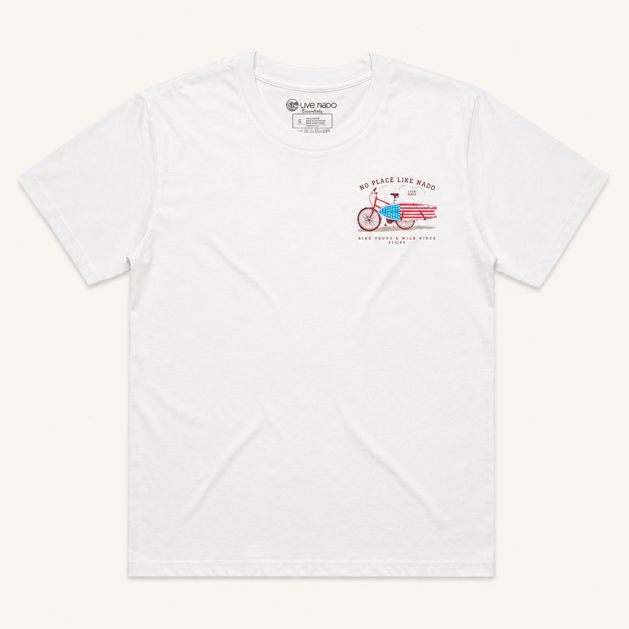 Flat lay of a white crewneck t-shirt with a small graphic on the left chest depicting a red bike carrying an American flag surfboard.