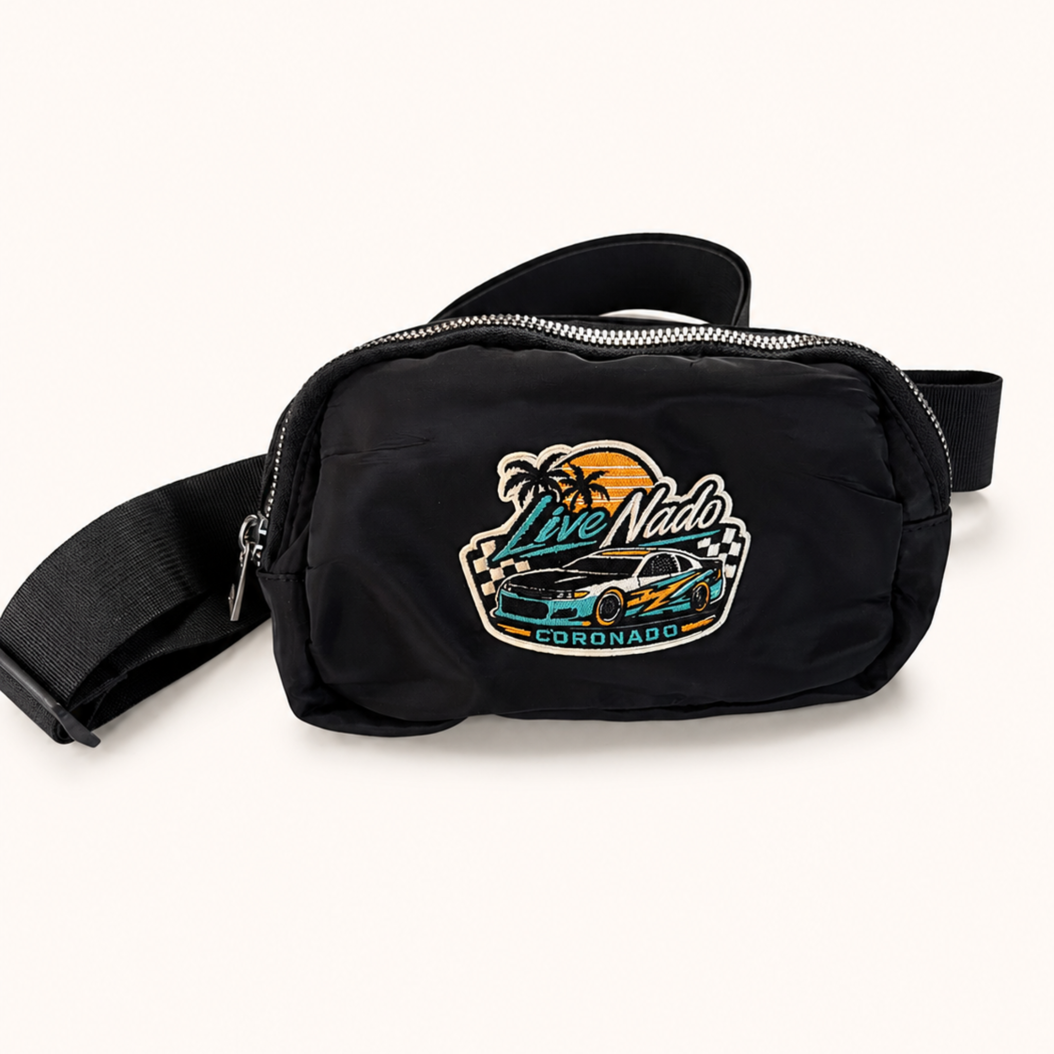 Black waist bag with a colorful graphic design on a white background