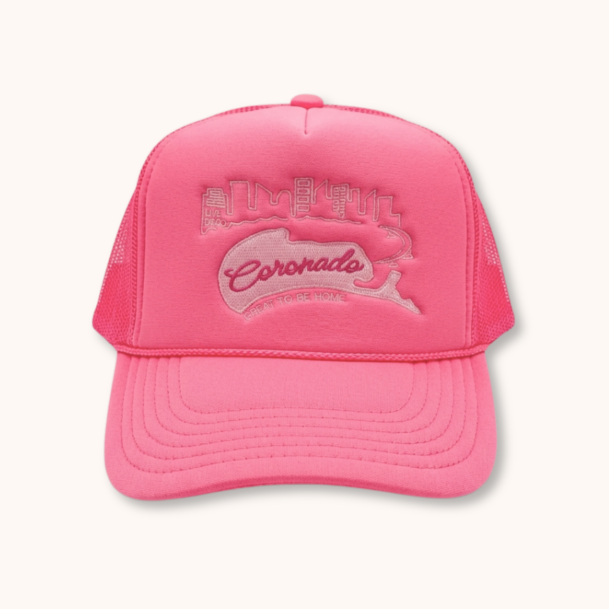 Pink cap with 'Coronado' logo on a white background