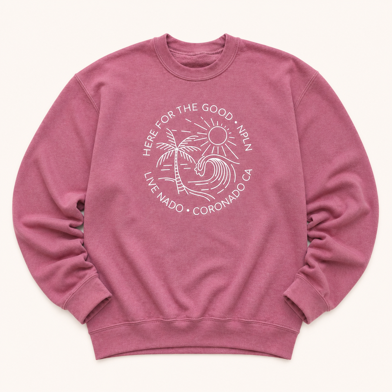 Pink sweatshirt with white graphic and text on a white background