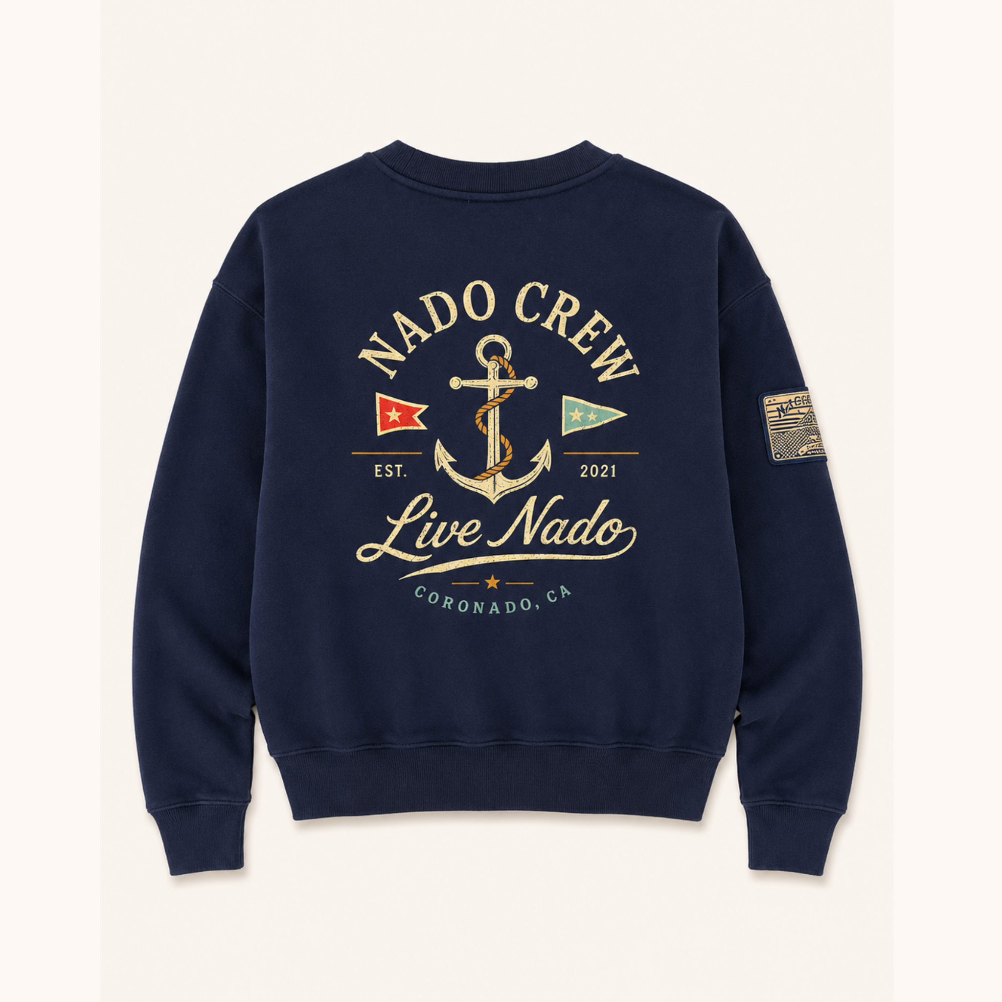 Flat lay showing the back of a navy blue sweatshirt with a large nautical anchor graphic that reads "NADO CREW" and "Live Nado."