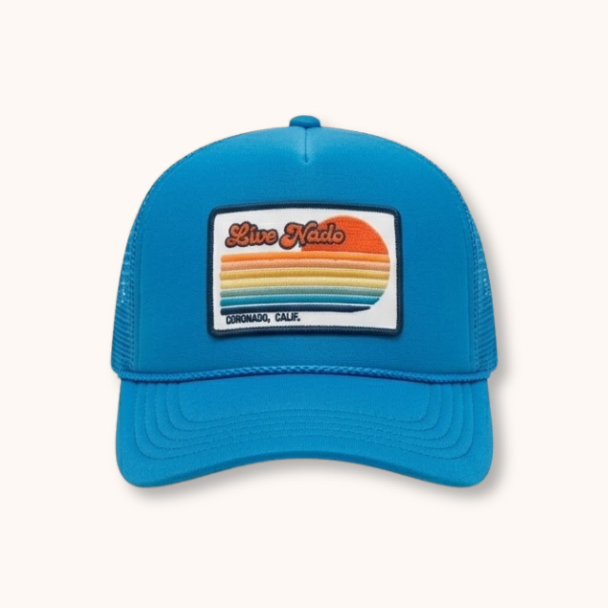 Blue trucker cap with a colorful patch on a white background