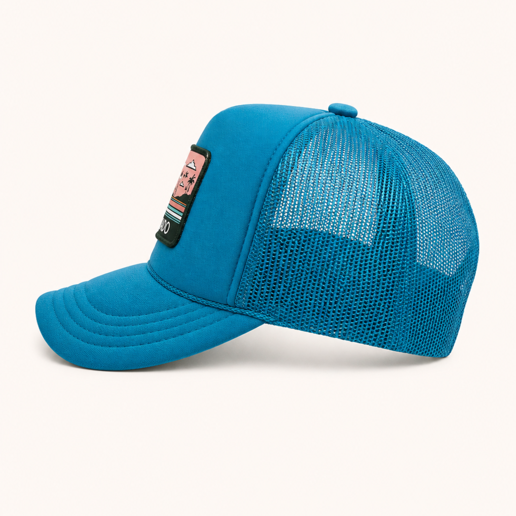 Blue mesh cap with a small patch on a white background