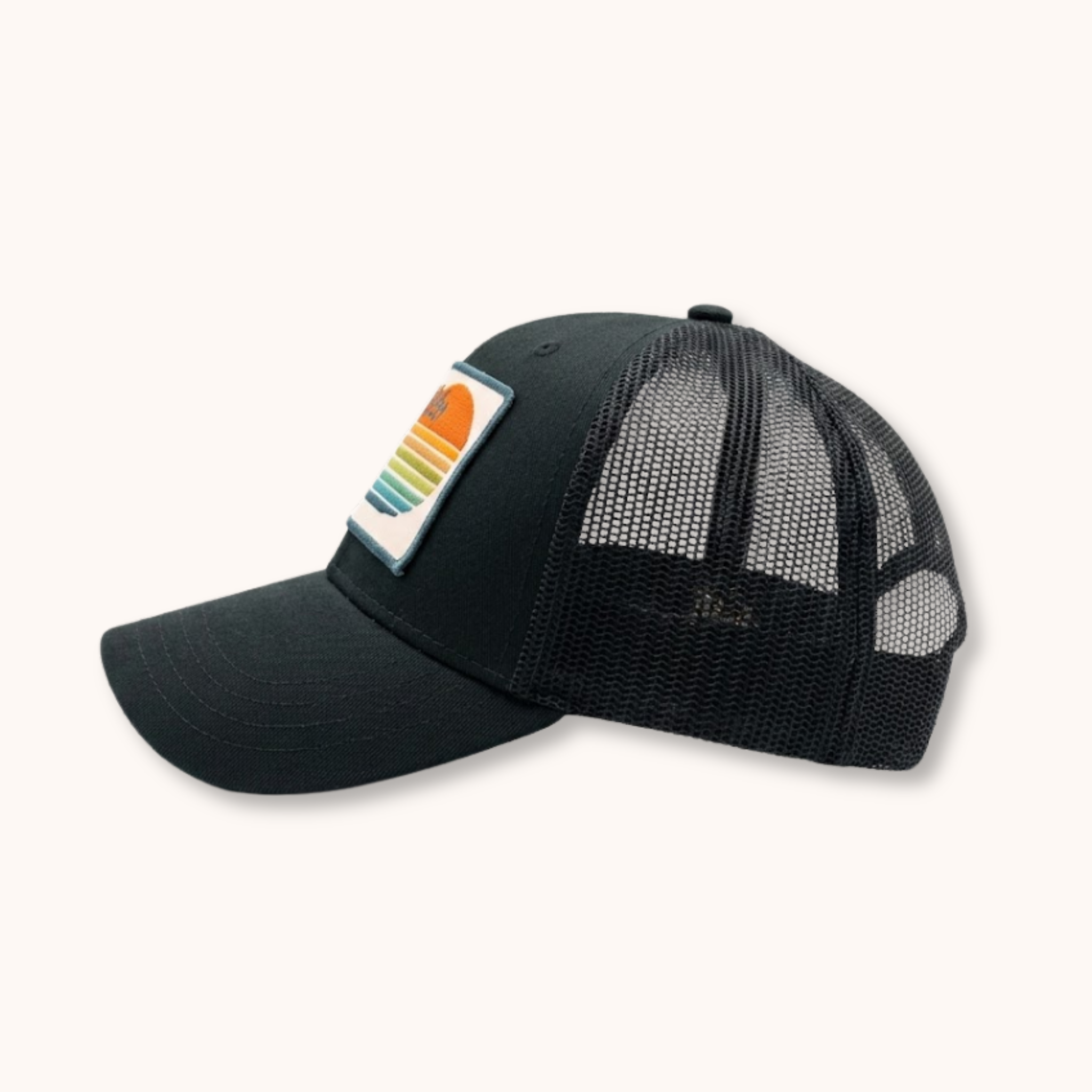 Black mesh cap with a colorful patch on a white background